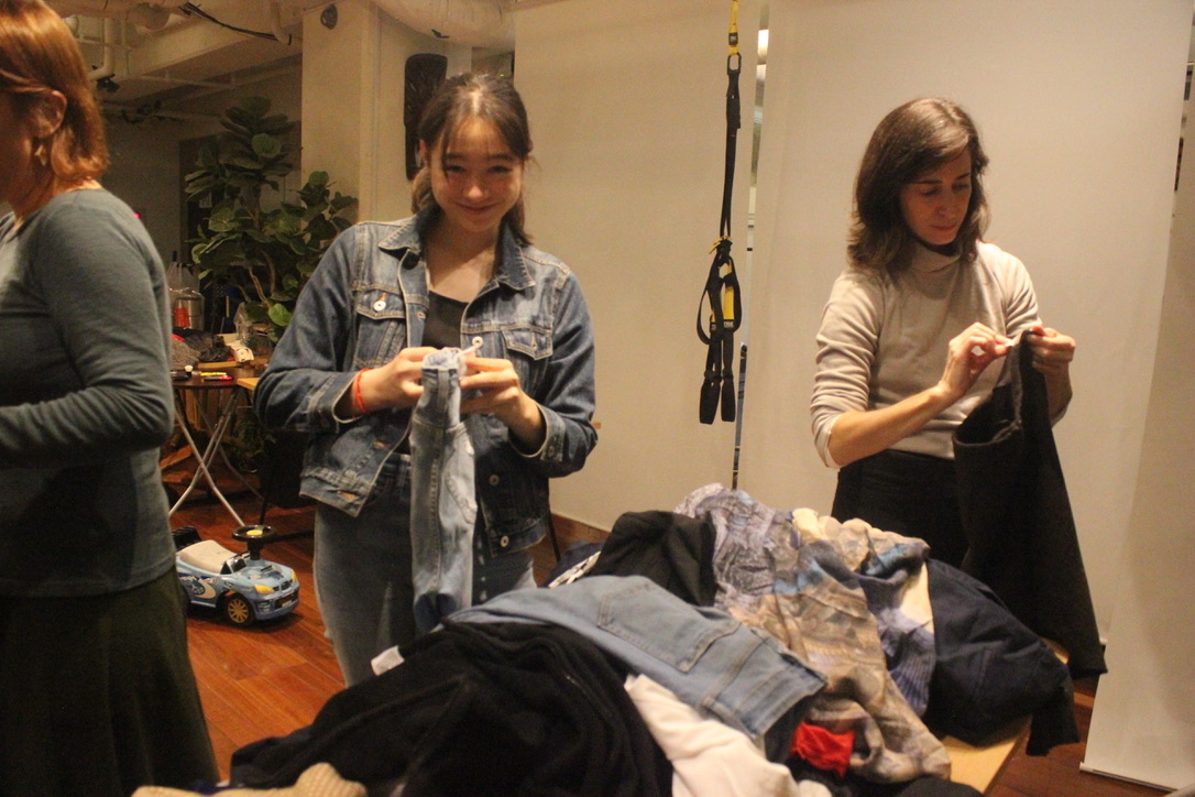 Women trying on clothes at the Ryozan Park clothing exchange